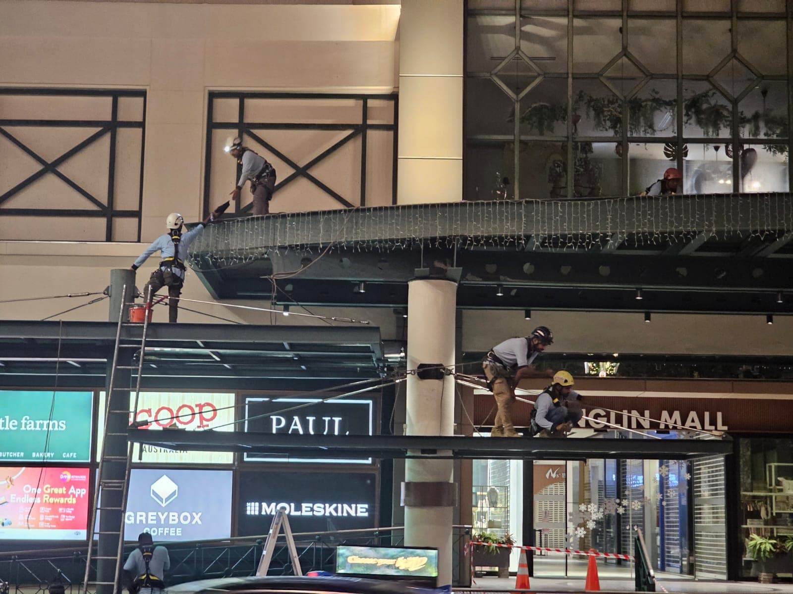 Hydroseal technicians performing signage and façade works at height on a Singapore mall